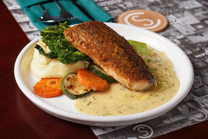 Seared Sea Bass with mashed potato and roasted vegetables at Le Café des Stagiaires