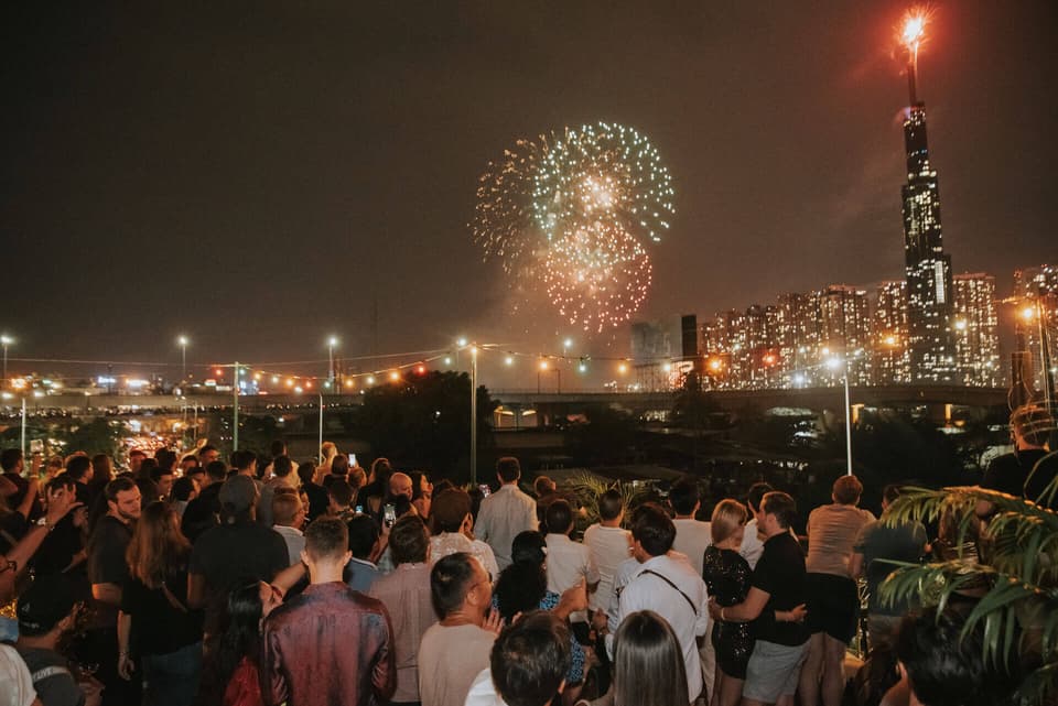 Fireworks over Landmark 81 seen from Le Café des Stagiaires rooftop in An Khanh